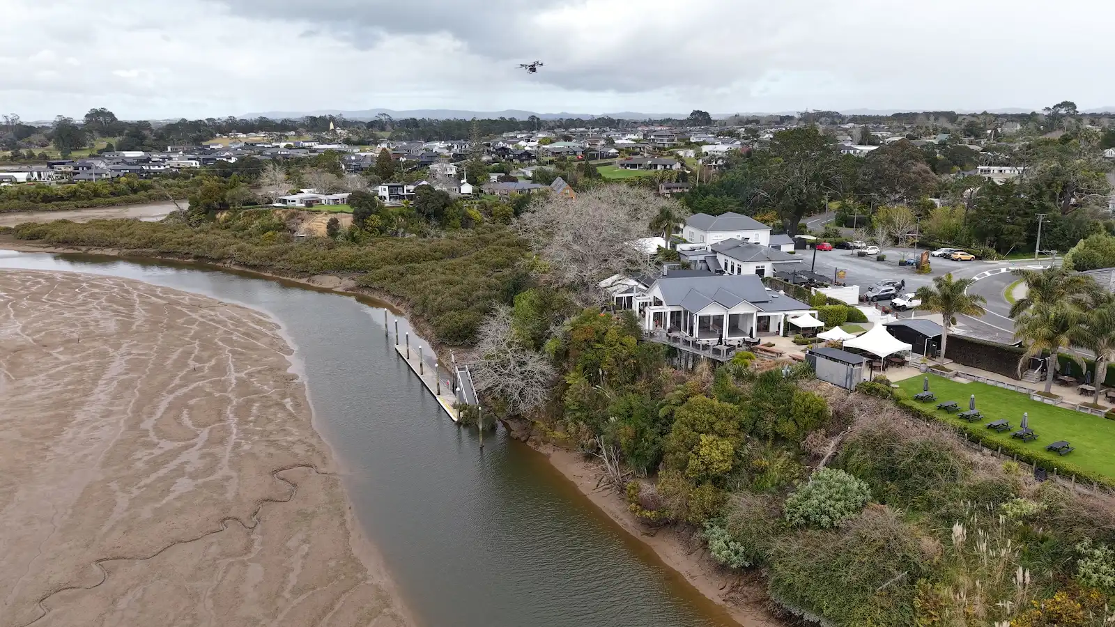 Aerial view of Riverhead Tavern waterfront, wharf and dead oak during drone-assisted tree removal